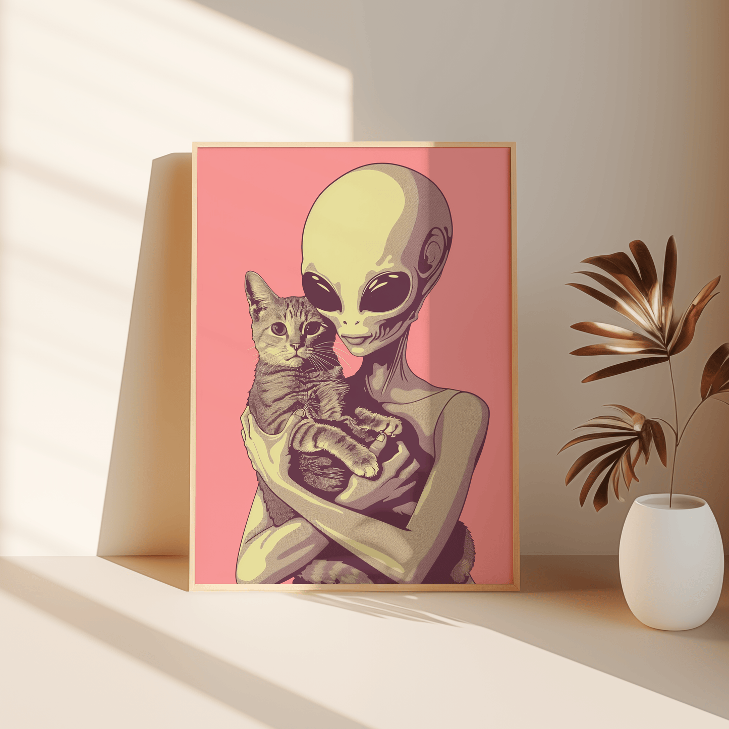Paw Prints framed poster of a retro alien cradling a tabby cat in a pink background, leaning against the bedroom floor.