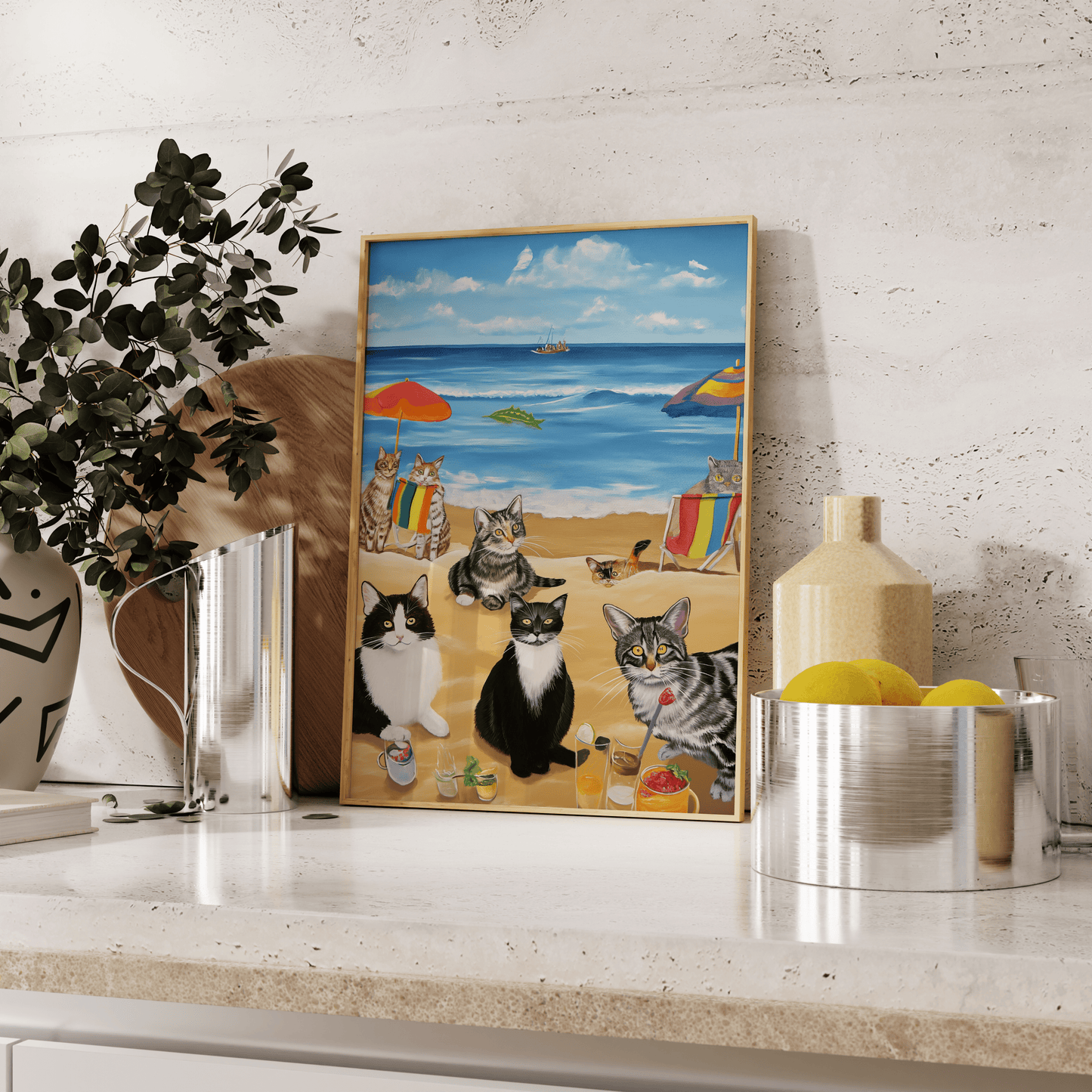 Paw Prints framed painting of a bunch of cats enjoying a beach day, leaning against the kitchen counter.