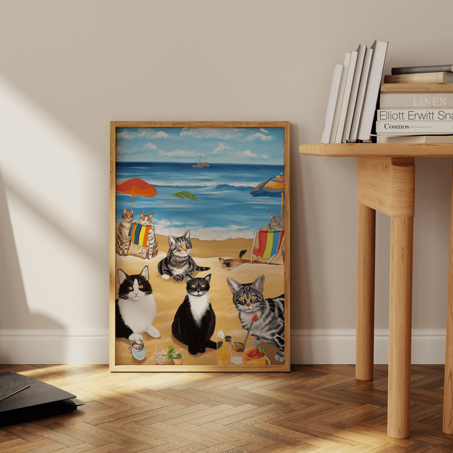 Paw Prints framed painting of a bunch of cats enjoying a beach day, leaning against the office floor.