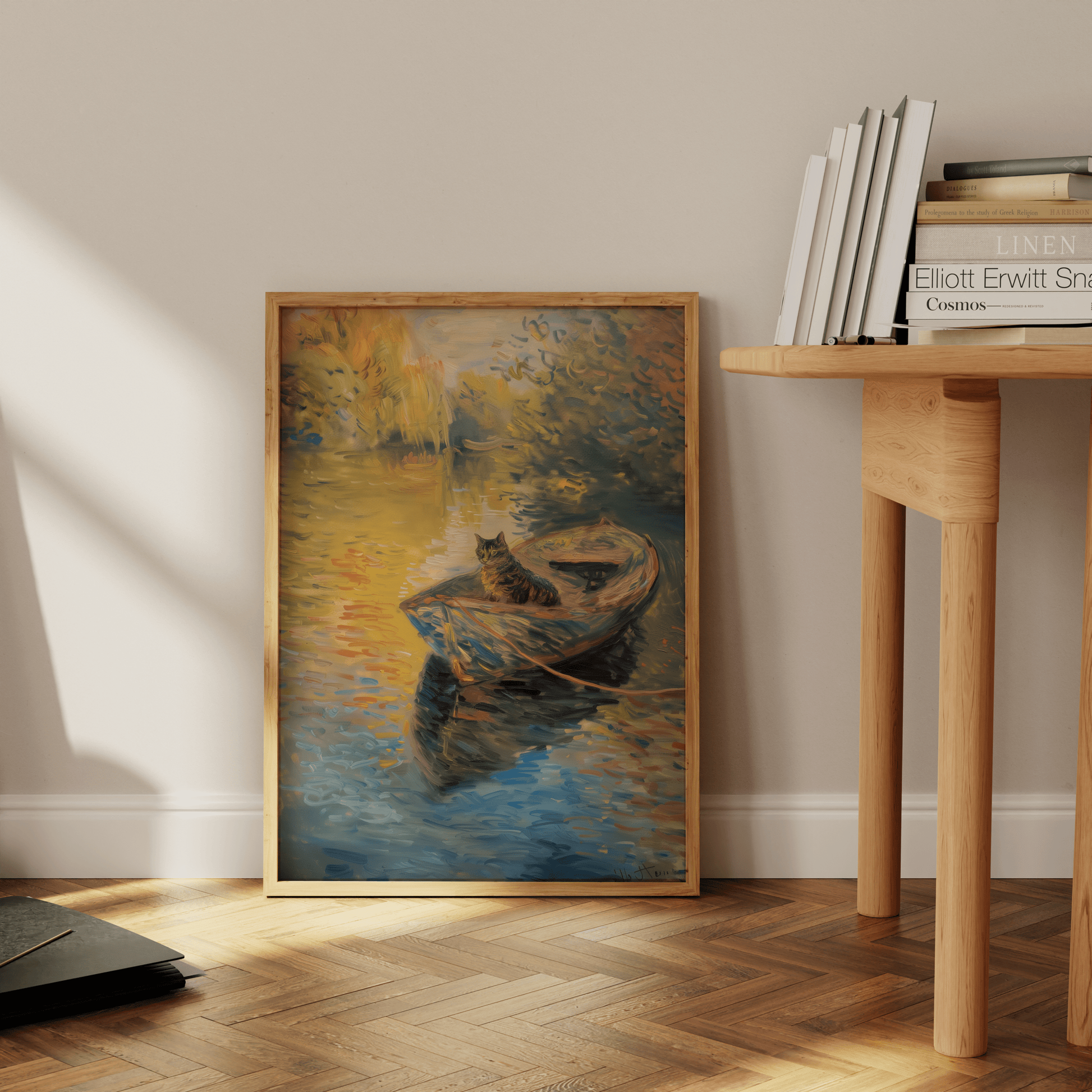 A cat sitting peacefully on a row boat in a serene river, in a Paw Prints framed poster leaning against the office floor.