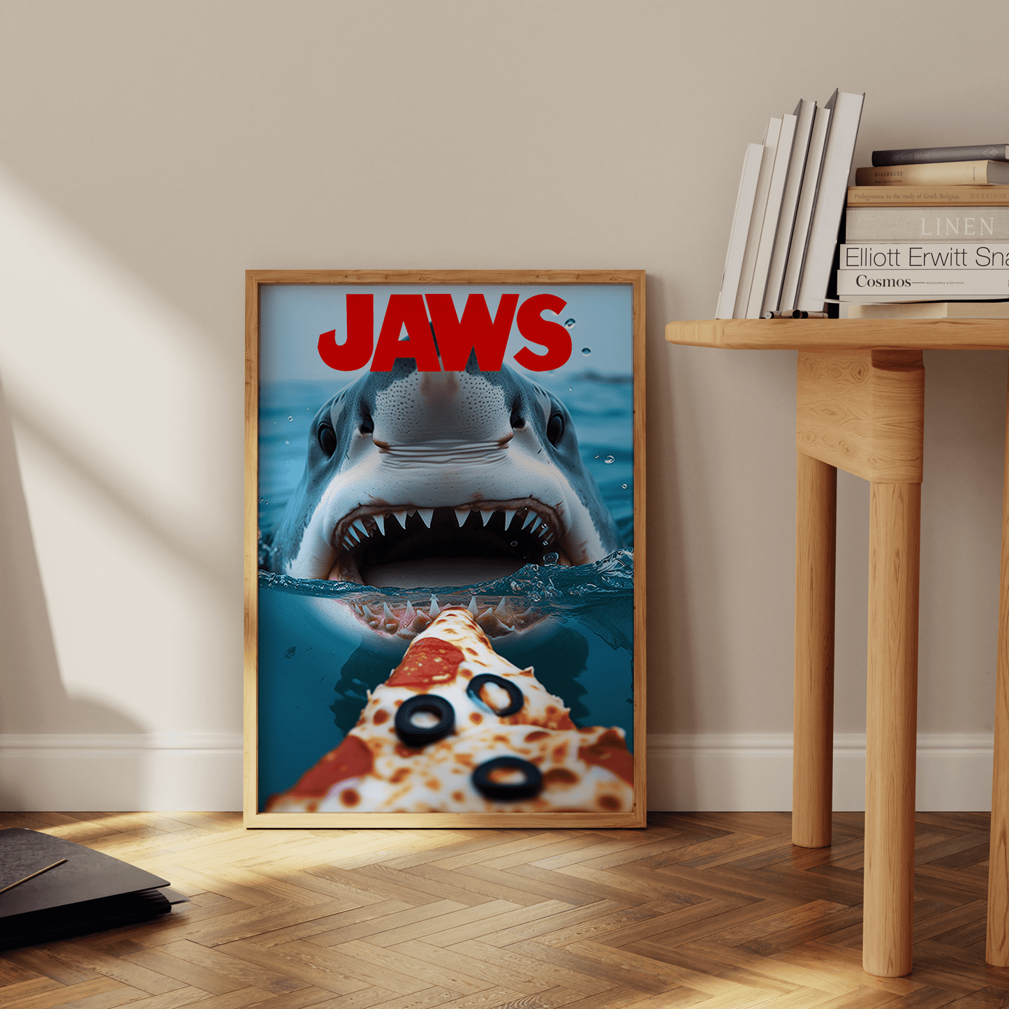 A JAWS movie poster with a great white shark about to eat a pizza, leaning against the office wall - Paw Prints
