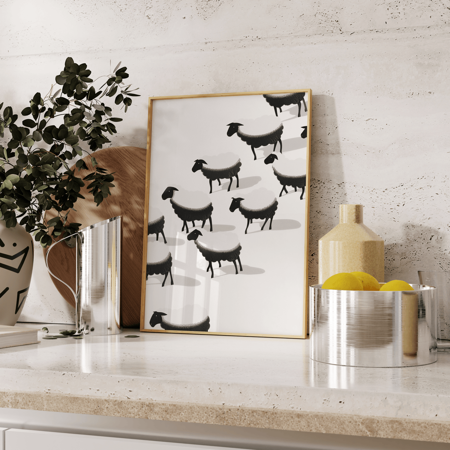 Framed painting of a herd of black and white sheep, leaning against the kitchen counter - Paw Prints