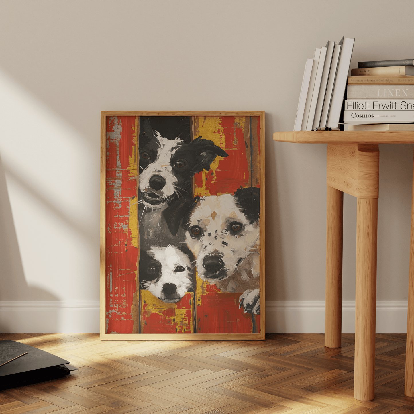 Banksy framed painting of three farm dogs peaking out of red barn doors, leaning against the office wall. - Paw Prints
