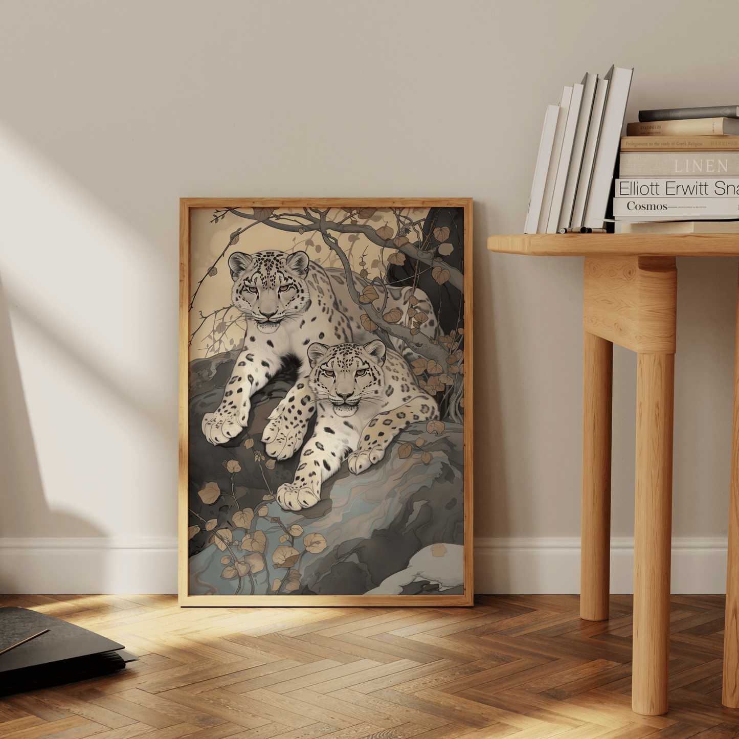 Painting of two twin snow leopards laying in nature, leaning against the office wall - Paw Prints