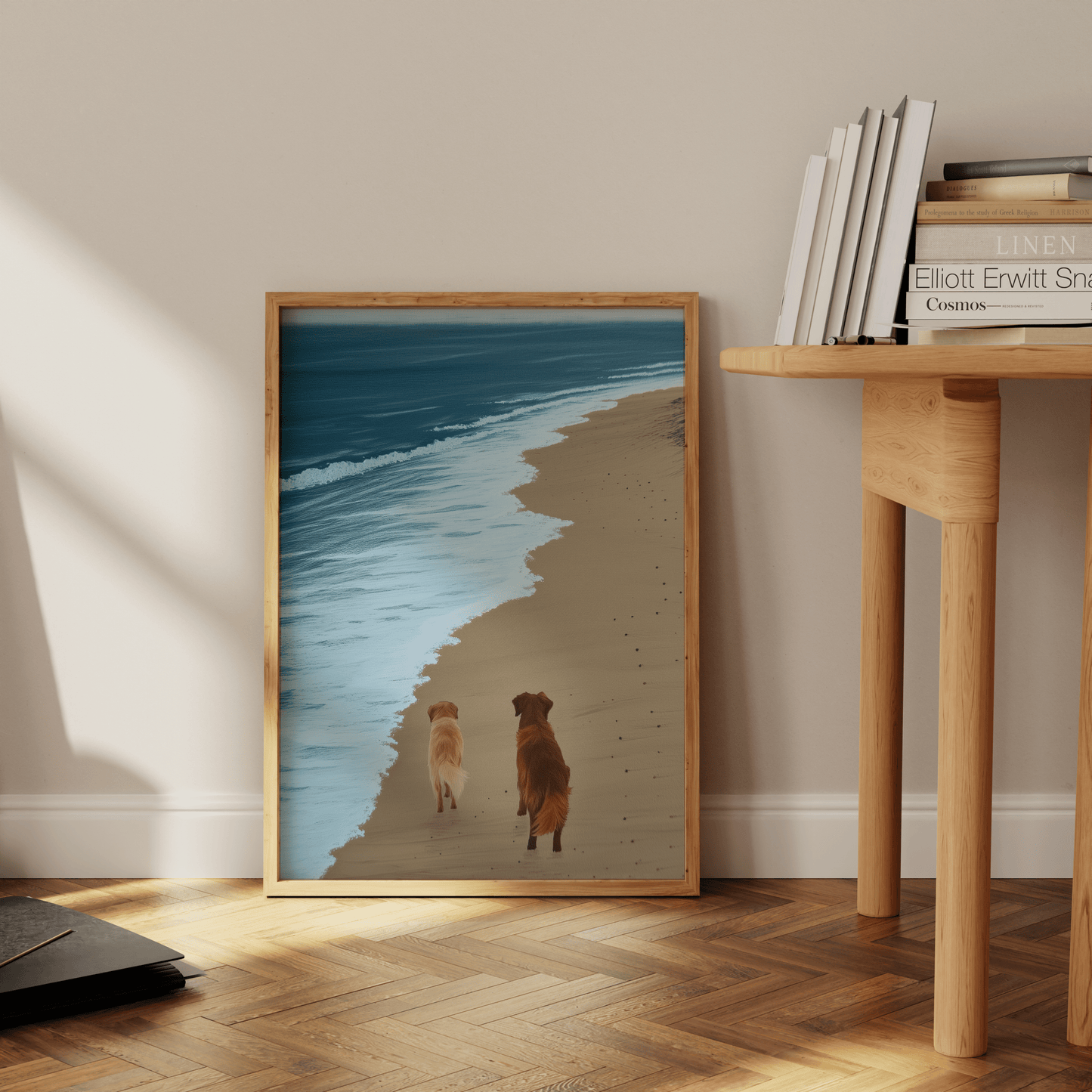 Paw Prints painting of two golden retrievers walking next to a calm ocean, leaning against the office floor.