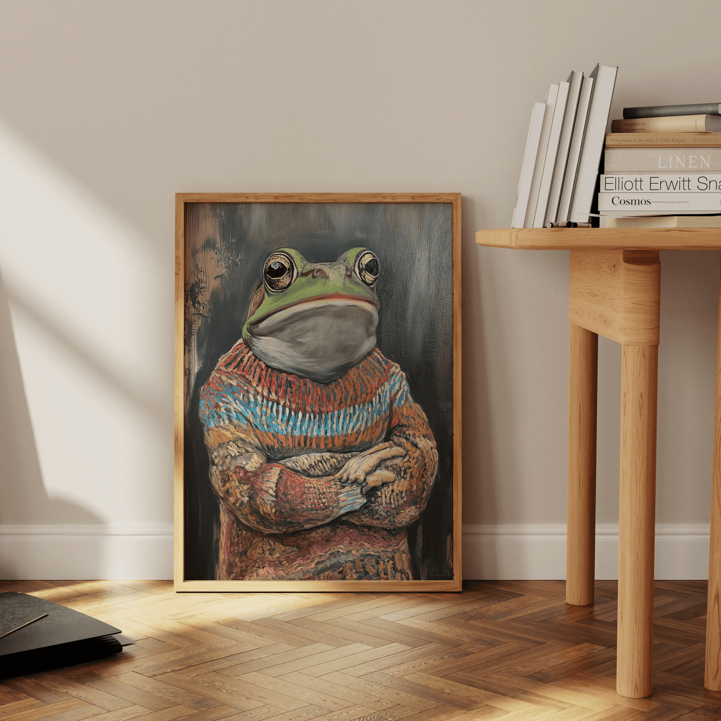 Framed painting of a grumpy frog wearing an ugly Christmas Sweater, leaning against the office wall - Paw Prints