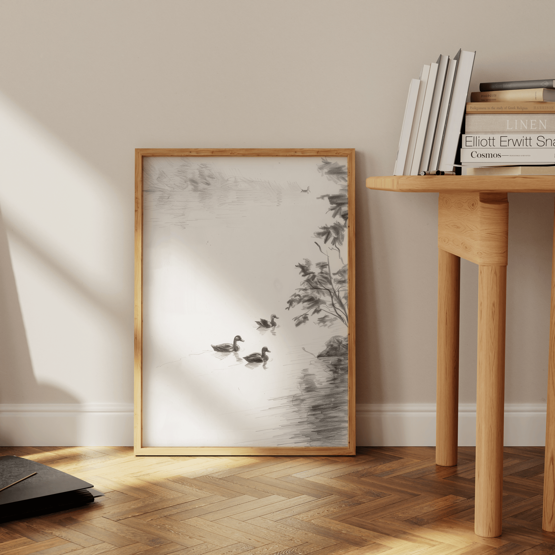 Black and white pencil sketch of 3 ducks swimming in a lake, leaning against the office wall - Paw Prints