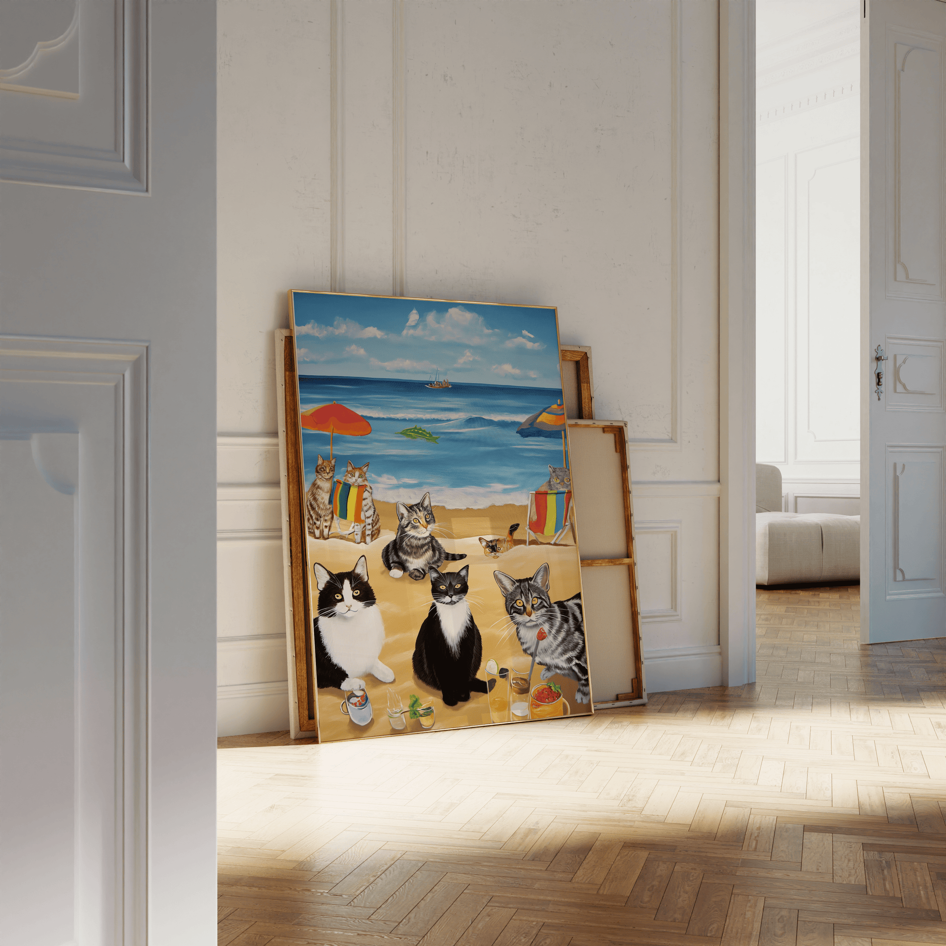 Paw Prints framed painting of a bunch of cats enjoying a beach day, leaning against a white bathroom wall. 