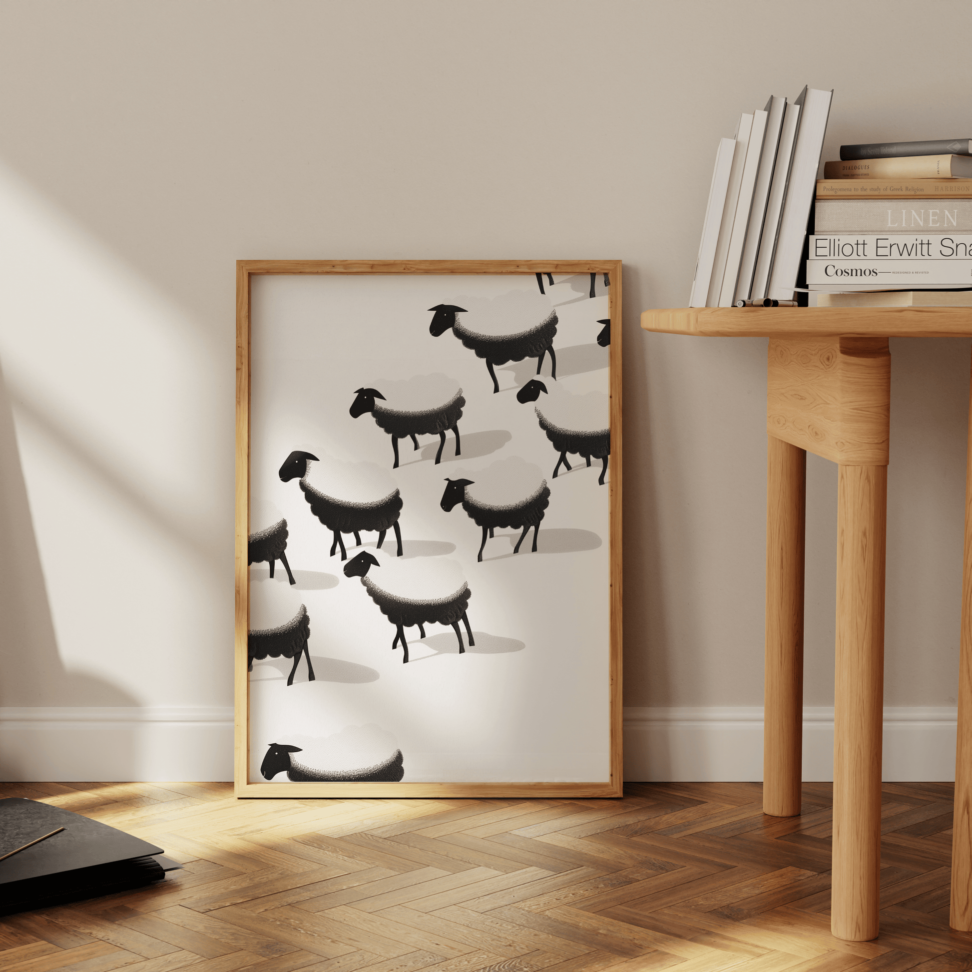 Framed painting of a herd of black and white sheep, leaning against the office wall - Paw Prints