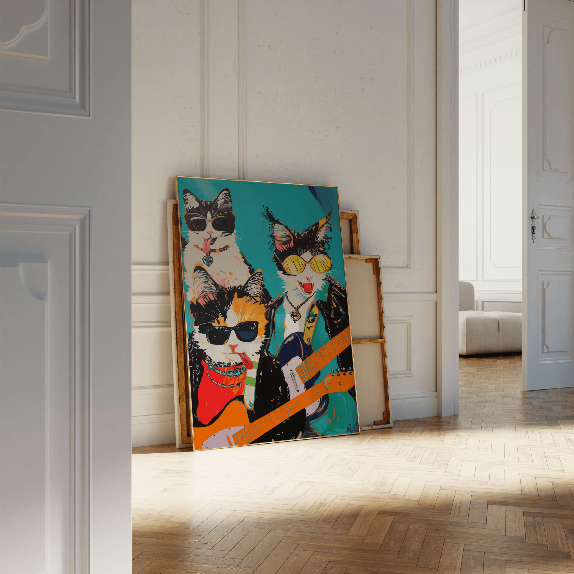 Framed poster of a rock band with three cats, holding electric guitars, leaning against a white bathroom wall - Paw Prints