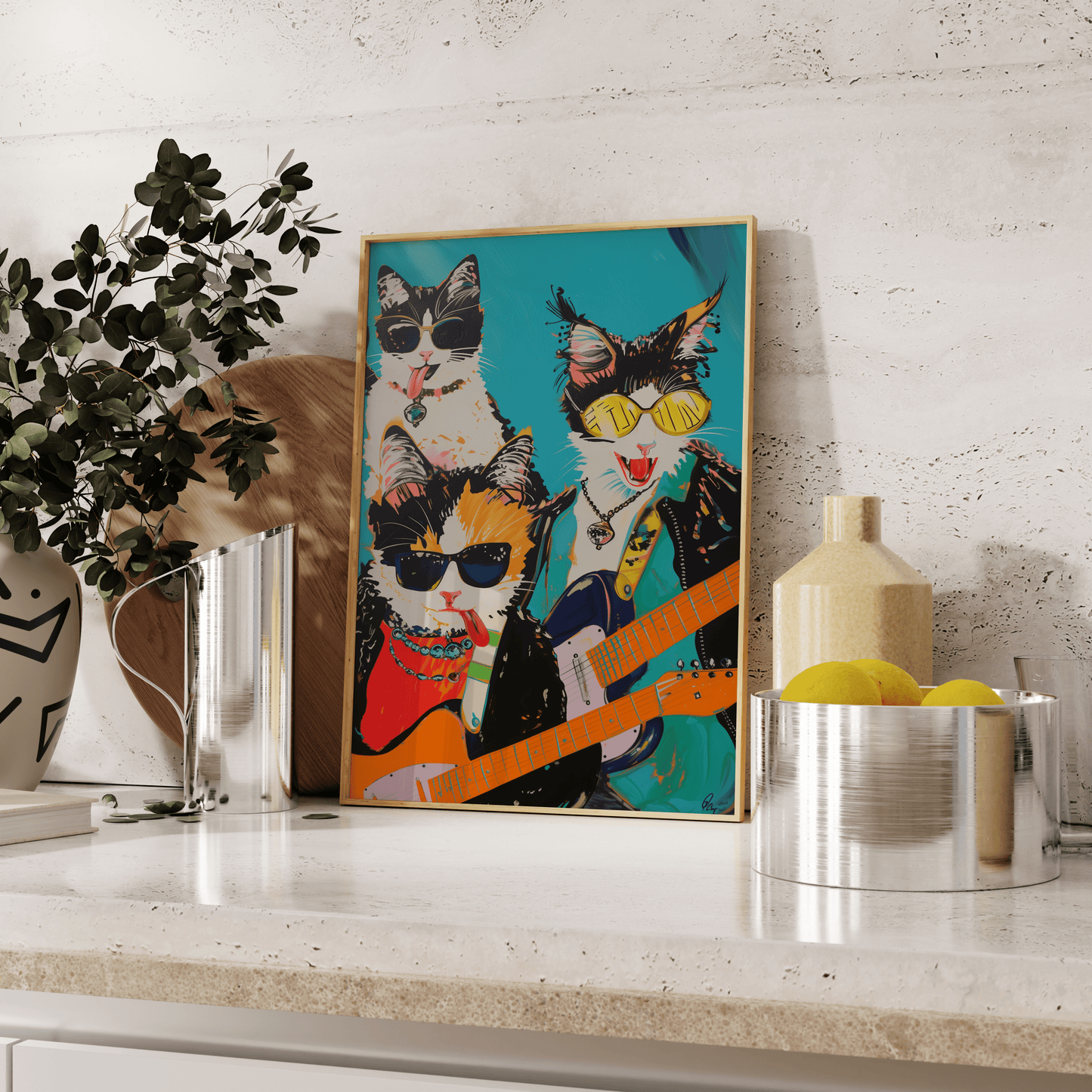 Framed poster of a rock band with three cats, holding electric guitars, leaning against the kitchen counter - Paw Prints