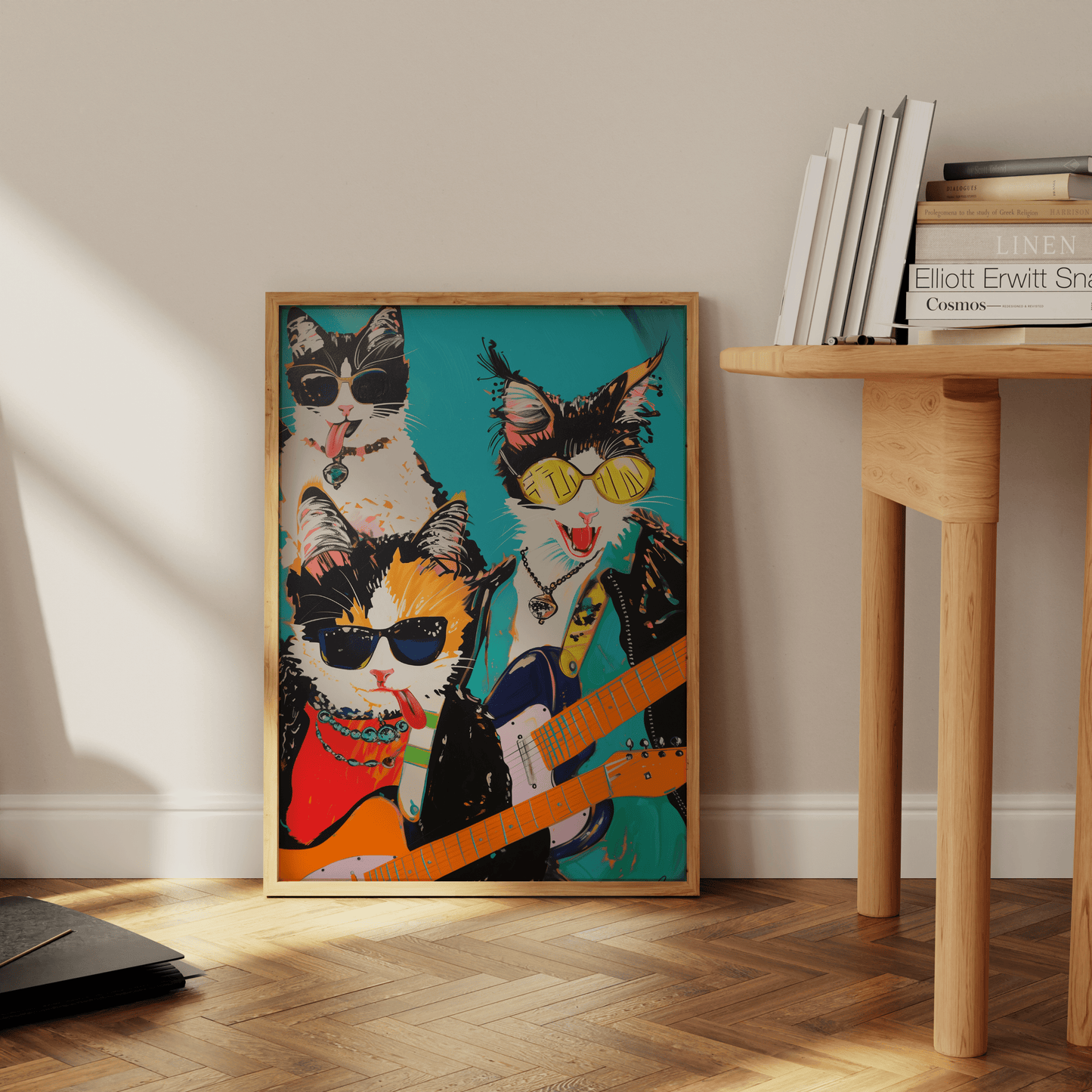 Framed poster of a rock band with three cats, holding electric guitars, leaning against the office wall - Paw Prints