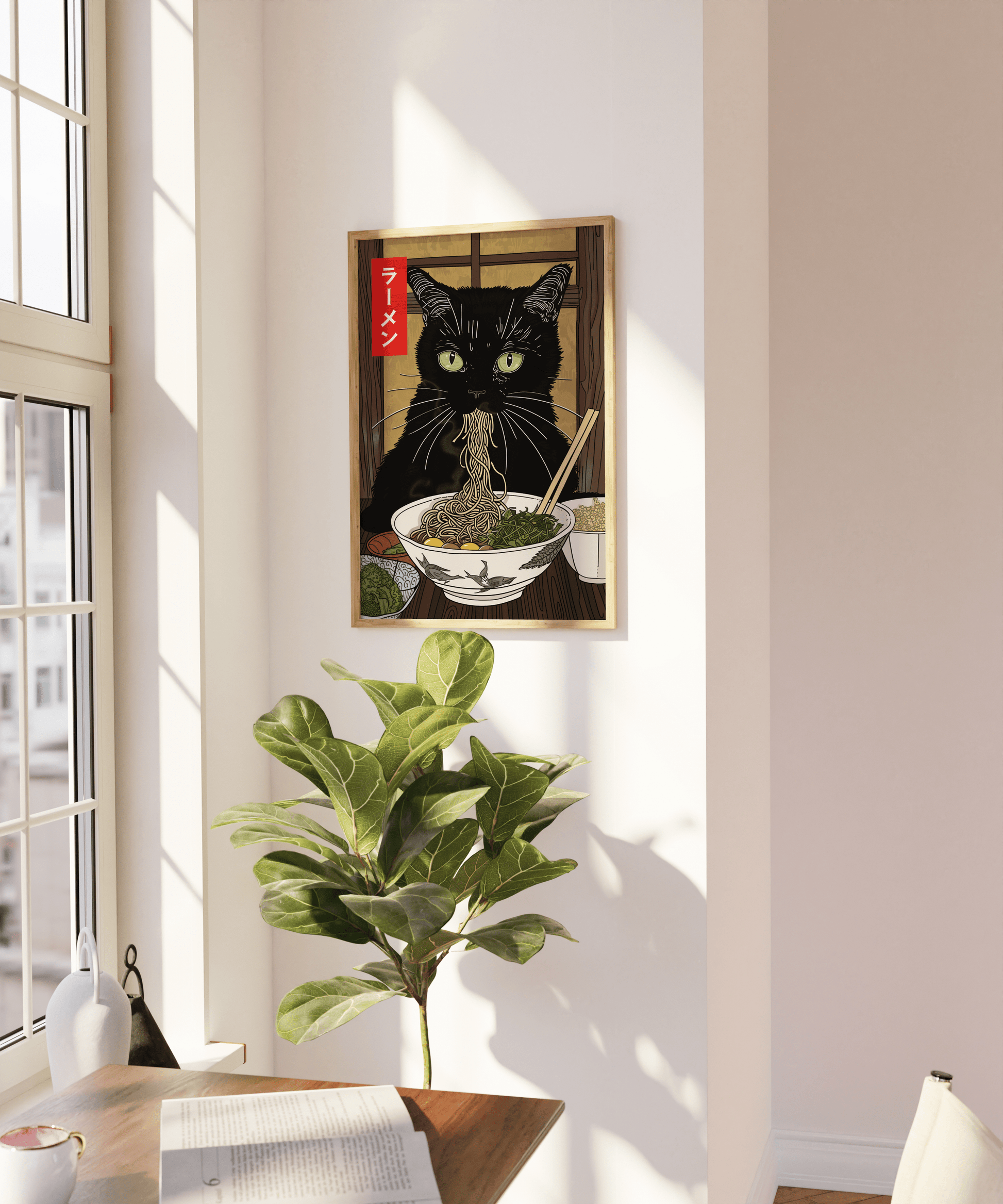 A framed artwork titled "Tokyo Miso" by My Store, featuring a black cat eating ramen, is hanging on a wall next to a sunlit window, adding charm to your home decor. Below, a green potted plant and a wooden table with a white book and pepper grinder are visible. Light streams into the room, illuminating the high-quality poster.