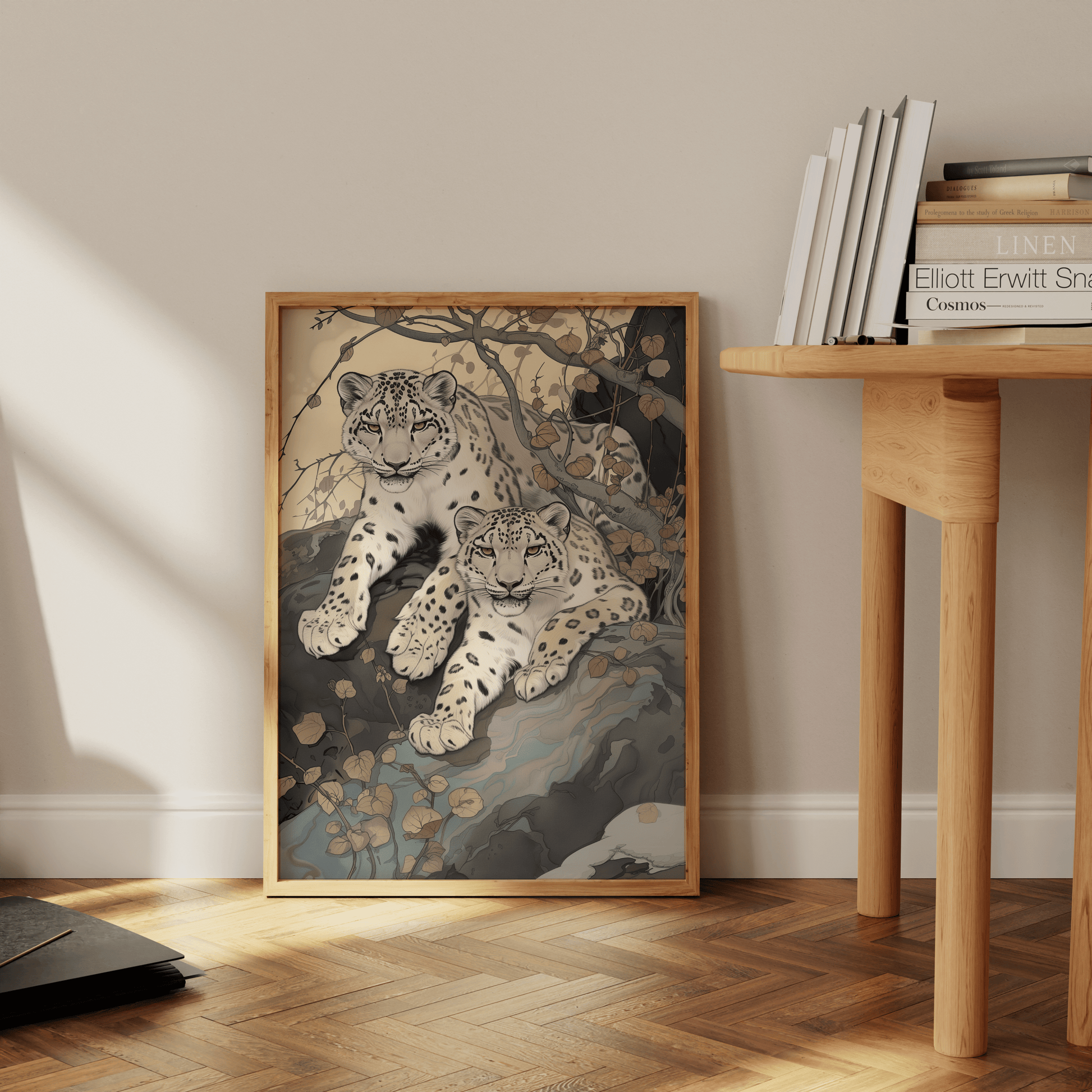 Painting of two twin snow leopards laying in nature, leaning against the office wall - Paw Prints