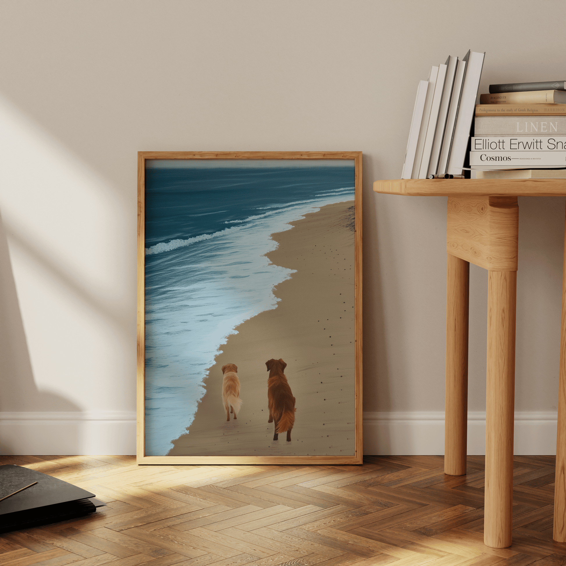 Paw Prints painting of two golden retrievers walking next to a calm ocean, leaning against the office floor. 